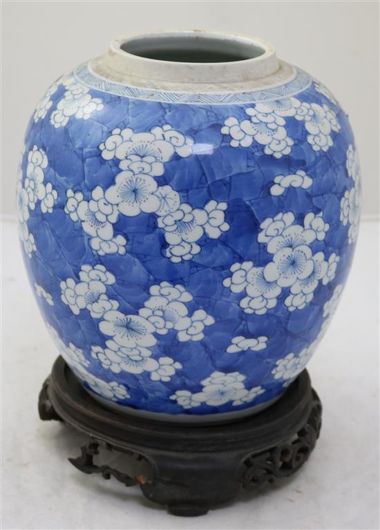 A Chinese blue and white ovoid jar, 18th century, height 21.5cm, wood stand